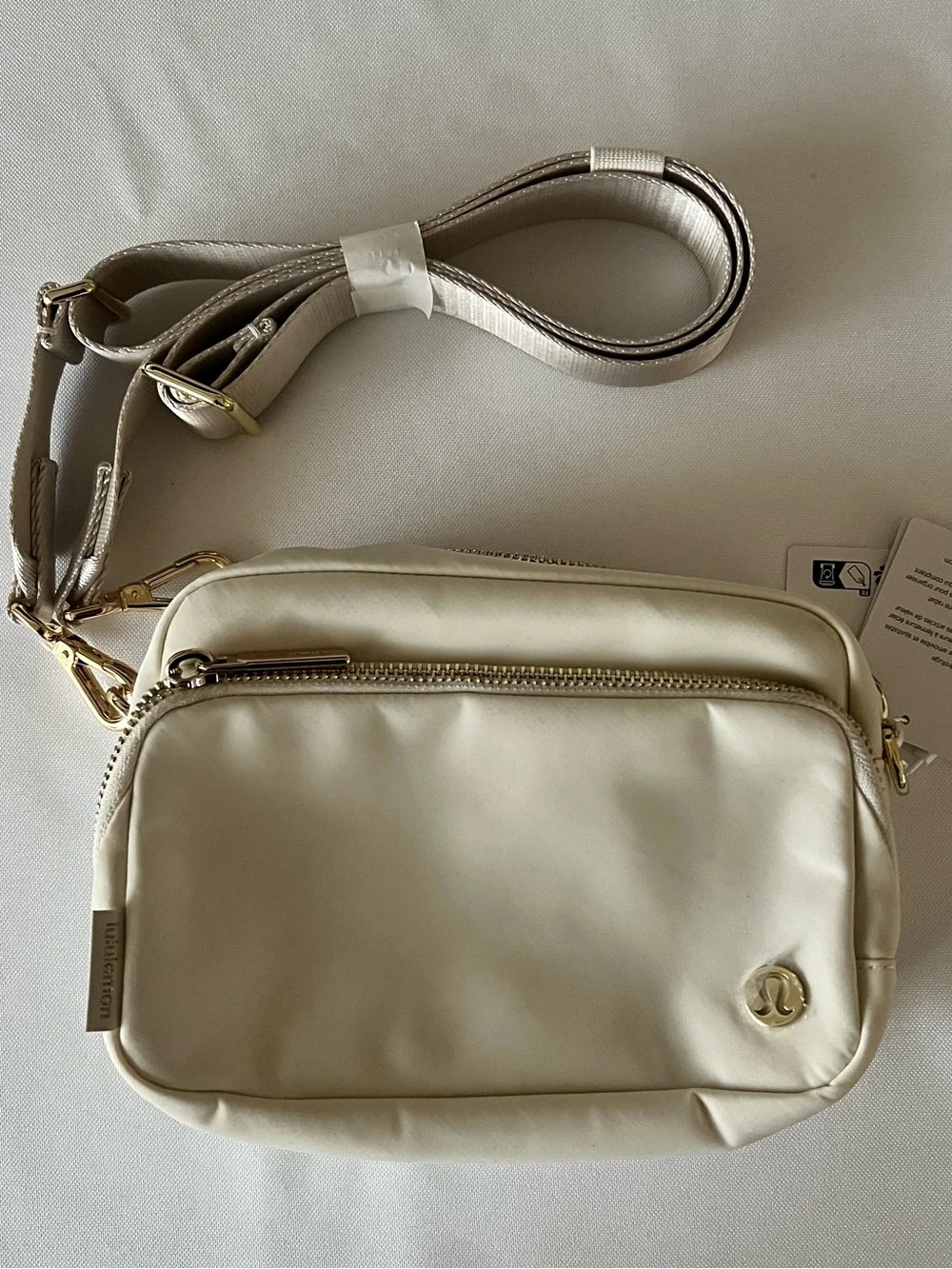 lululemon athletica Ivory Crossbody Bag with Gold Hardware